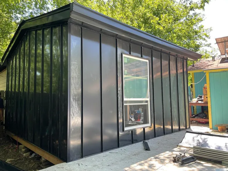 Black standing seam metal wall panels for Roof Inspection in Dolton